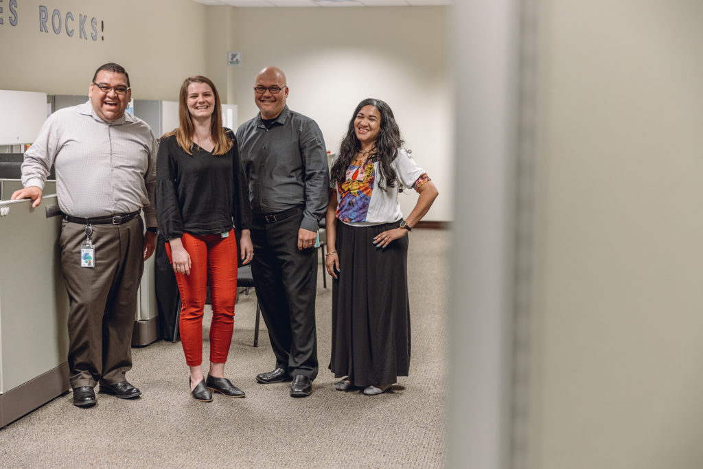 Accounting Staff Standing in Front of Their Cubicles