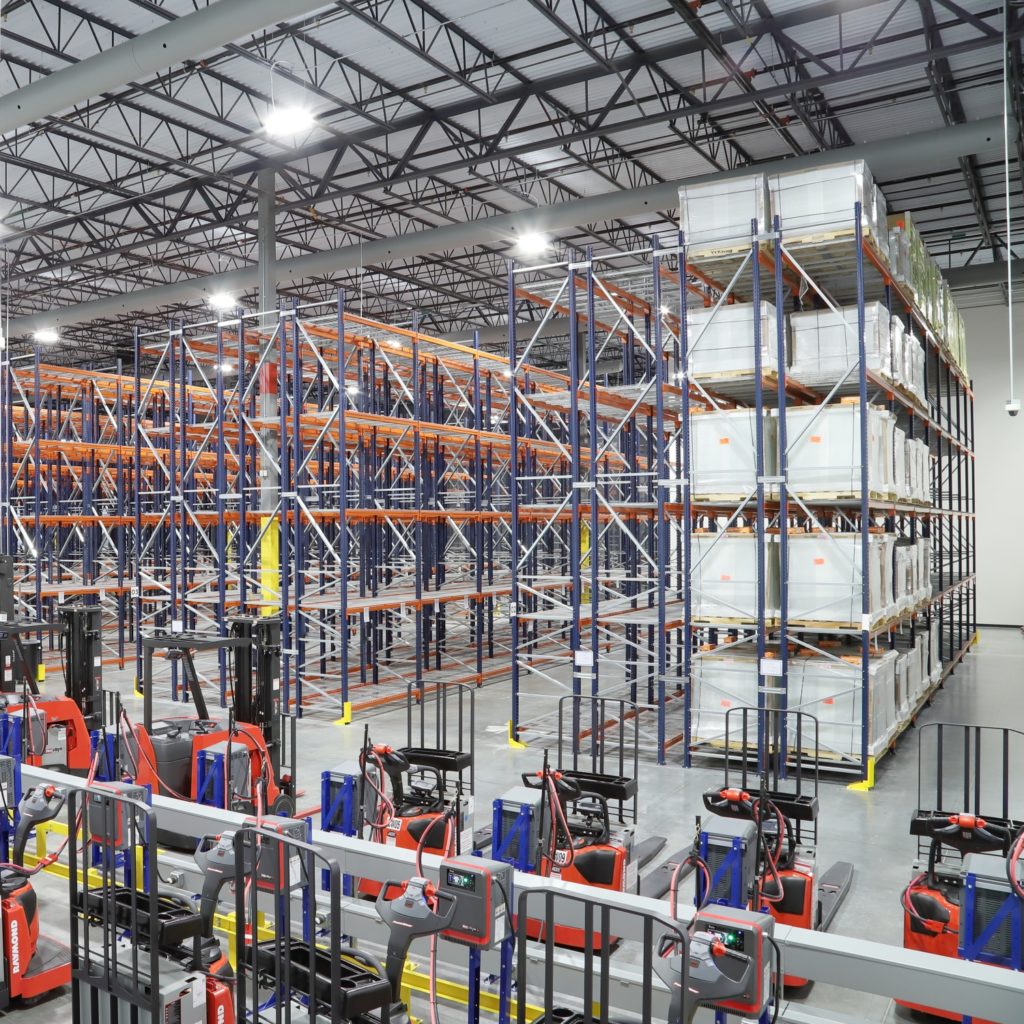 FDA Registered LSL Warehouse Facility with Rows of Boxes, Racks for Storage and Forklifts