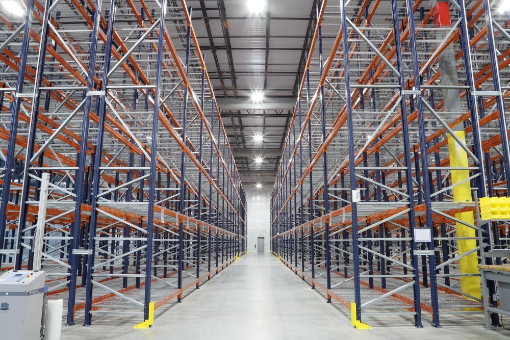 Certified Humidity Monitored Warehouse with Rows of Empty Racks for Holding Boxes