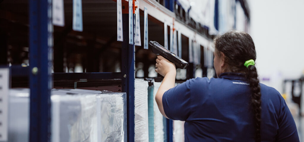 Woman Scanning Labels and Performing Quality Check in LSL Warehouse